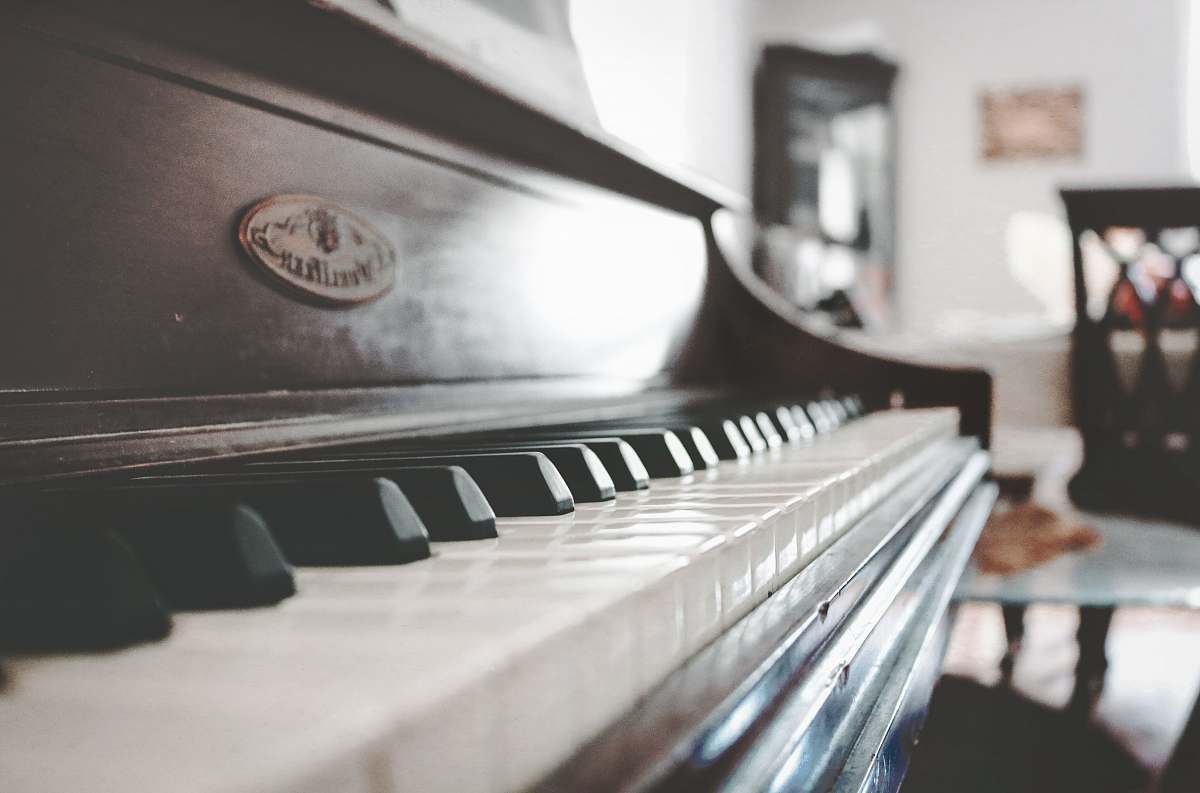 musical instrument tilt shift focus photo of upright piano piano